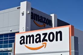 Original black lowercase text 'amazon' with an orange curved arrow shape underneath connecting the first 'a' to the 'z' logo featuring white, orange, black colours