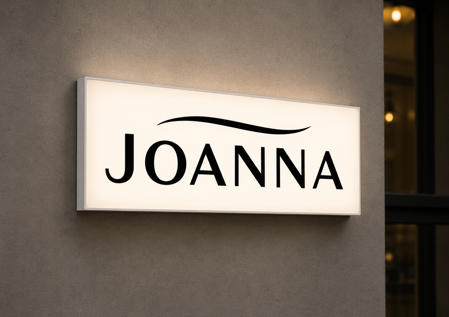 Original black text 'JOANNA' with a long black curved line above it on a white rectangular panel logo featuring white, black, gray colours