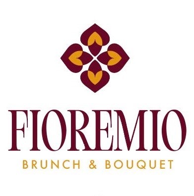 Original logo with burgundy text 'FIOREMIO' and gold text 'BRUNCH & BOUQUET' beneath a four-petal burgundy and gold floral emblem logo featuring white, burgundy, gold colours